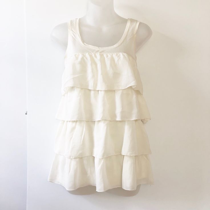 Nwt H&M Cream Ruffled Layered Top, Very Cute And Flowy. Brand New, Never Worn. Small Makeup Mark Inside Will Wash Out, It Was Bought That Way. Summer Tops With Tiered Ruffle Hem, Summer Tops With Ruffle Hem And Tiered Shape, Summer Tiered Top With Ruffle Hem, Casual White Tiered Top, White Tiered Casual Tops, Chic Tiered Ruffle Tops, White Tiered Summer Top, White Tiered Tops For Summer, White Tiered Top With Ruffle Hem