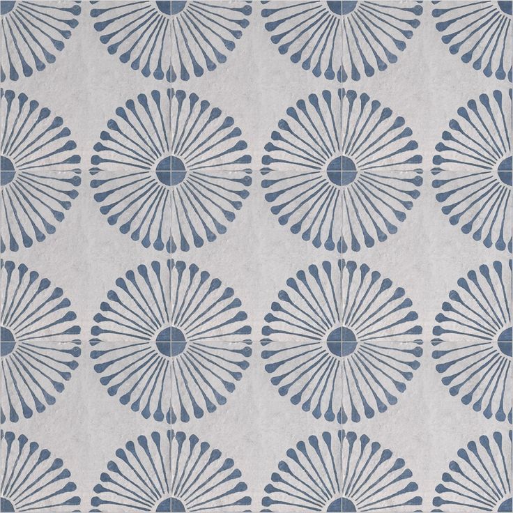 a blue and white wallpaper with an intricate design