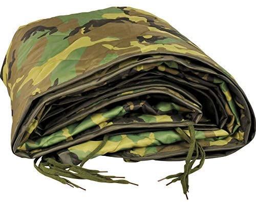 the camouflage blanket is folded on top of each other and ready to be used for camping