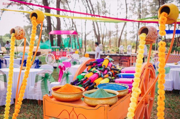 an outdoor event with colorful decorations and food