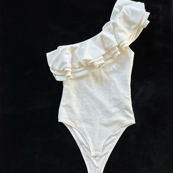 H&M Bodysuit Nwt Size: Xs Color: Off White - Bundle To Save Extra $$$ Off - Fitted Cotton Bodysuit With Ruffles, Fitted Cotton Ruffle Bodysuit, Chic Cotton Bodysuit For Spring, Fitted Cream Swimwear For Party, Cream Fitted Swimwear For Party, Chic White Swimwear With Ruffles, Fitted Cotton Bodysuit For Party, Fitted Ruffles Bodysuit For Brunch, Fitted Ruffle Tops For Beachwear