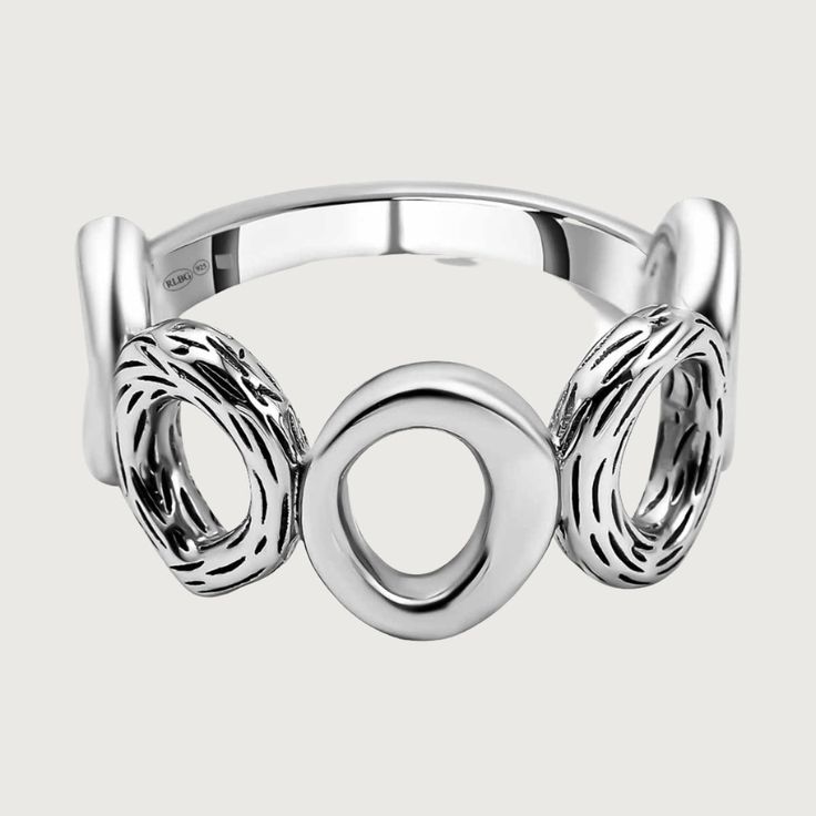 Add some elegance to your style with our Ocean Multi Loop Ring. This silver ring features multiple loops for a unique and versatile look. A must-have addition to any jewelry collection. Elevate your outfits with this stunning piece! Elegant Open Ring Stackable Rings, Elegant Stackable Open Rings, Metal Jewelry With Ring Detail And Modern Twist, Elegant Jewelry With Metal Round Band Ring, Elegant Jewelry With Metal Ring In Round Band, Modern Metal Jewelry With Ring Detail, Modern Twist Silver Metal Jewelry, Modern Twist Silver Jewelry, Modern Twist White Gold Jewelry With Ring Detail