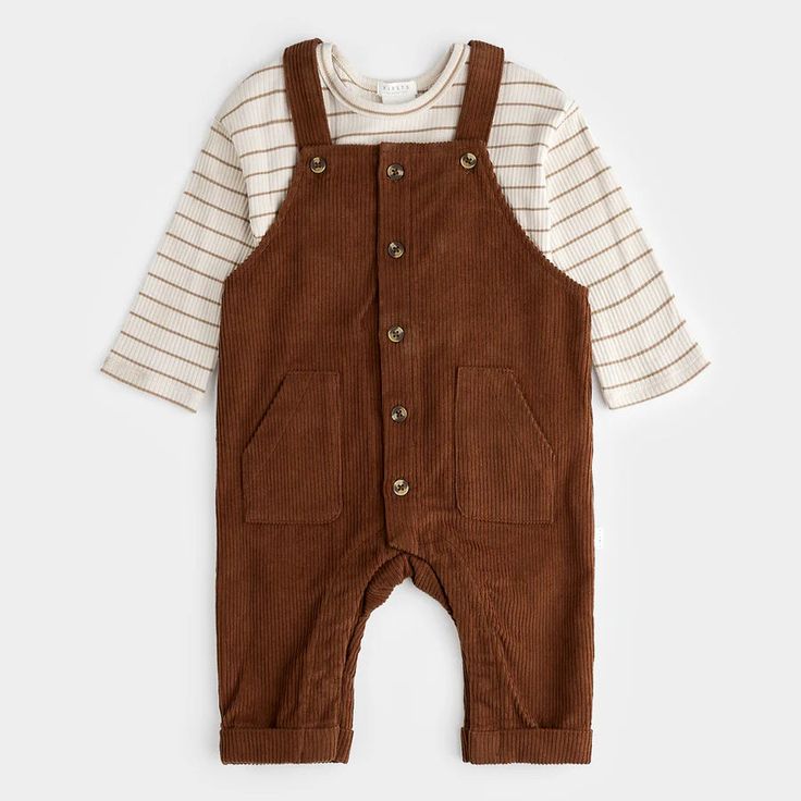 This brown corduroy overall set is perfect for any casual day out. Its comfortable material and stylish design will keep you looking and feeling great, while its unique Mustang detailing adds a touch of fun to your outfit. Stay on trend and stand out in this must-have overall set. Features: - Top composition: 95% Organically grown cotton, 5% elastane jersey Overalls composition: 100% Organic cotton corduroy Buttons down the front Long-sleeved t-shirt Brown Cotton Winter Jumpsuits And Rompers, Brown Cotton Overalls For Spring, Winter Corduroy Overalls, Brown Corduroy Overalls With Pockets, Casual Corduroy Overalls For Fall, Spring Brown Cotton Jumpsuits And Rompers, Casual Fall Corduroy Overalls, Brown Cotton Jumpsuit For Spring, Corduroy Overall