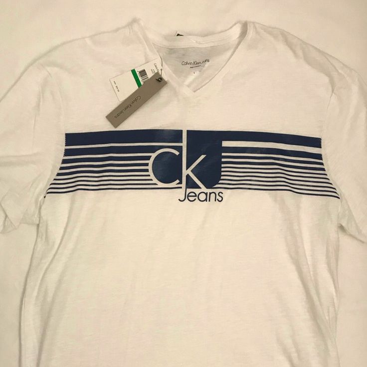 Brand New Spring Cotton Logo T-shirt, Calvin Klein Crew Neck T-shirt For Spring, Calvin Klein Graphic Tee With Crew Neck, Calvin Klein Relaxed Fit Casual T-shirt, Calvin Klein Logo Cotton Tops, Calvin Klein Cotton Logo Tops, Calvin Klein Cotton Tops With Logo, Relaxed Fit Logo T-shirt For Spring, Calvin Klein Graphic Tee Short Sleeve T-shirt