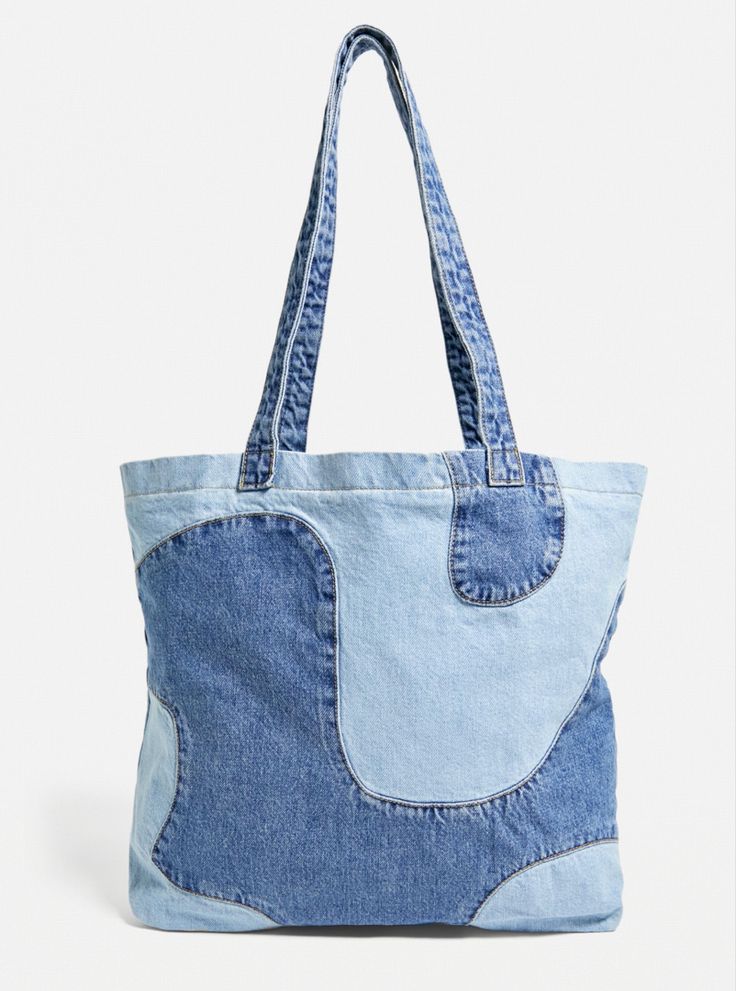 a bag made out of blue jeans on a white background