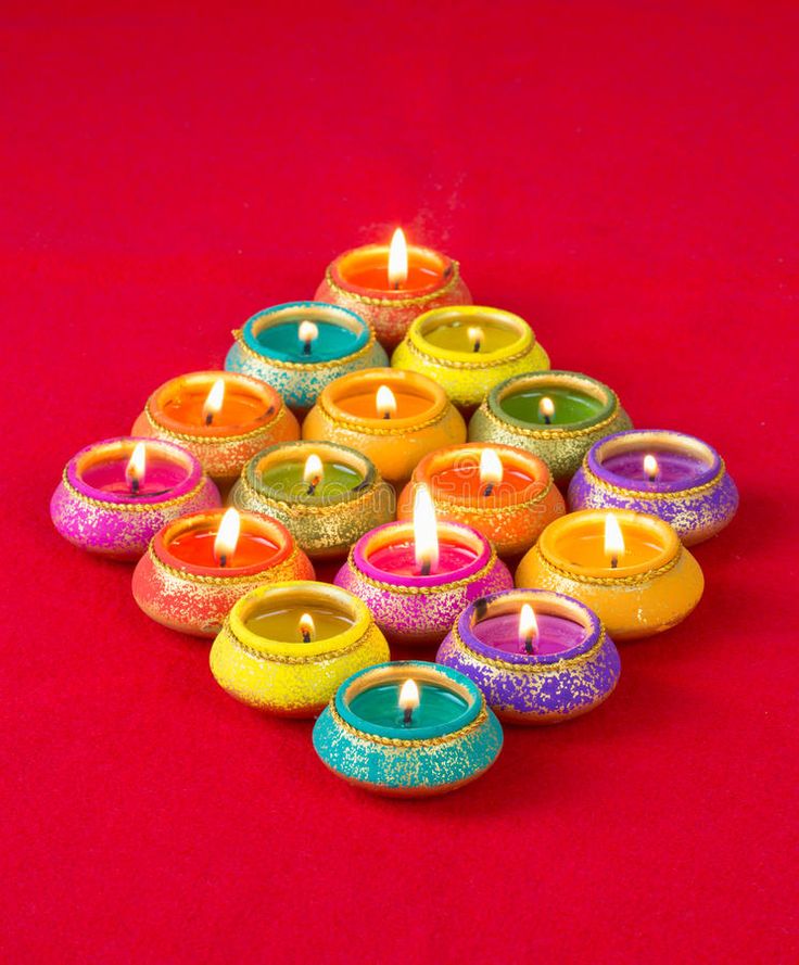 colorful candles are arranged in the shape of a pyramid