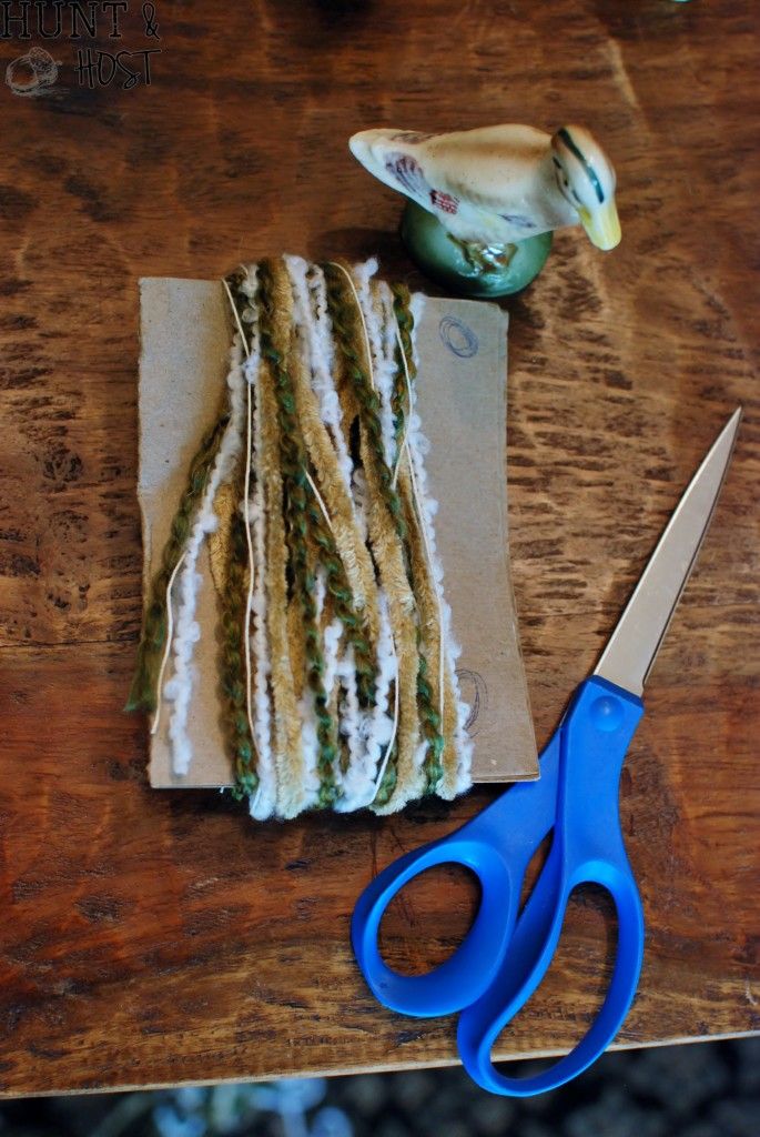 a pair of blue scissors sitting on top of a wooden table next to some food