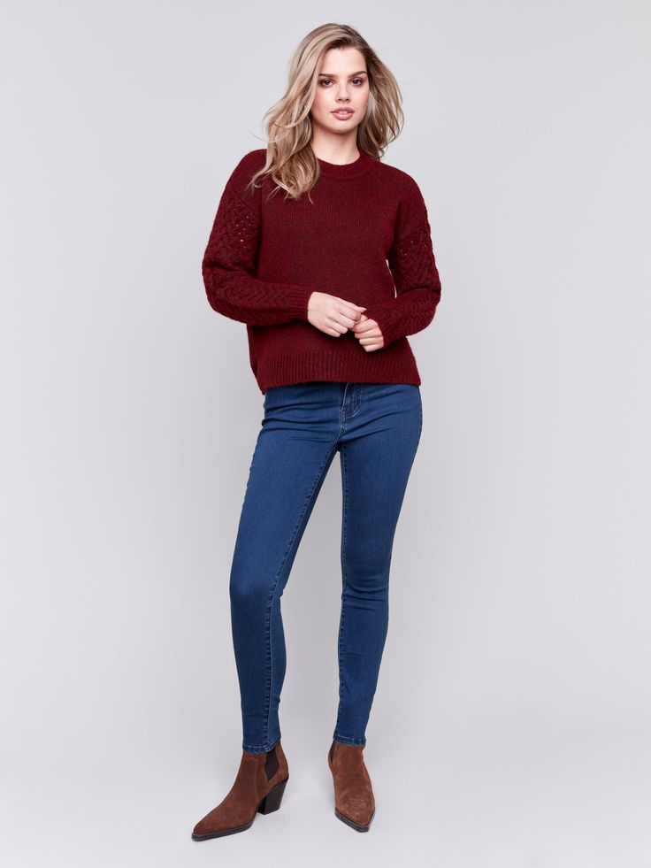 This beautiful mixed media sweater is a fall must have! The Cabernet color is gorgeous and can take you from fall thru winter in total style. The sleeves are fishnet open knit and the body is solid knit. She is super cozy and soft and looks amazing with our Charlie B Floral Embroidered Bootcut Jeans! Shown in the picture. Content : 33% Recycled Polyester / 36% Polyester / 20% Acrylic / 11% Nylon Back Length : 24" Care Instructions : Hand wash in cold water – Do not bleach – Lay flat to dry – Iro Trendy Knit Top For Fall Layering, Chunky Knit Sweater For Layering, Chunky Knit Sweater For Fall Layering, Cable Knit Sweater For Fall, Winter Stretch Open Knit Top, Fall Layering Tops With Chunky Knit, Chic Open Knit Top For Fall, Stretch Open Knit Winter Top, Stretch Open Knit Top For Winter