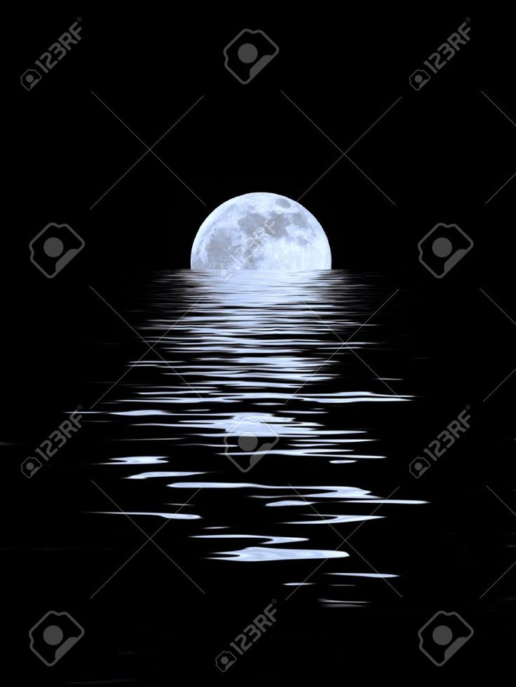 the full moon is reflected in the water on a dark night stock photo - 9579