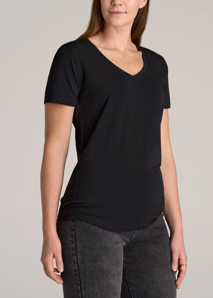 About Our Shirts for Tall Women More than just a regular tee. This women’s tall V-neck t-shirt has been specially designed just for you and is an everyday basic you’ll want to wear year-round. Having wardrobe staples that fit perfectly is a luxury that most tall women don’t have, which is why we exclusively design all our shirts for tall women between 5’9” and 6’6”. The rounded hem will end well below your hips where it’s supposed to and the scoop V neckline is ultra-flattering on any shape. Thi High Stretch Basic Scoop Neck T-shirt, Fitted Black T-shirt With Scoop Neck, Black High Stretch Short Sleeve T-shirt, Black Scoop Neck T-shirt For Everyday, V-neck Stretch T-shirt, Tall Jeans, Shirts Black, Scoop Neck Tee, Tall Clothing