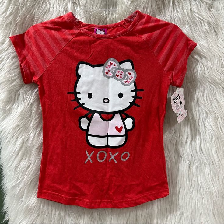 a red hello kitty shirt with an xoxo on it