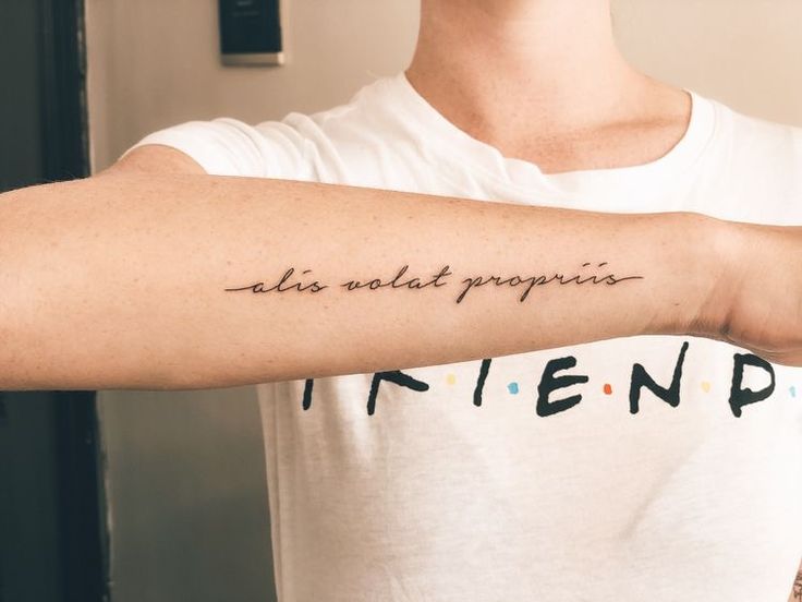 a person with a tattoo on their arm that reads, aids not propensis friend