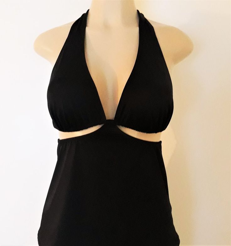 Elegant Halter Top With Built-in Bra For Vacation, Backless Halter Top With Built-in Bra, Black Tie-back Halter Top For Pool, Black Halter Top With Tie Back For Pool, Halter Neck Top With Built-in Bra For Pool, Elegant Halter Neck Top For Poolside, Elegant Halter Top For Poolside, Fitted Halter Neck Tankini With Built-in Bra, Elegant Fitted Halter Top For Poolside