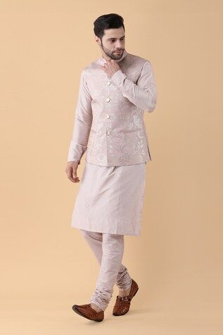 Pink bundi crafted in cotton silk with all over sequin bloom embroidery. Paired with a plain kurta and a churidar. - Aza Fashions Spring Cotton Nehru Jacket With Zari Work, Spring Cotton Bandhgala Bollywood Style, Bollywood Style Cotton Nehru Jacket For Spring, Fitted Nehru Jacket With Zari Work For Spring, Cotton Nehru Jacket For Spring Wedding, Spring Cotton Silk Nehru Jacket With Chikankari Embroidery, Spring Nehru Jacket With Chikankari Embroidery In Cotton Silk, Festive Cotton Silk Fitted Nehru Jacket, Cotton Bandhgala For Spring Wedding