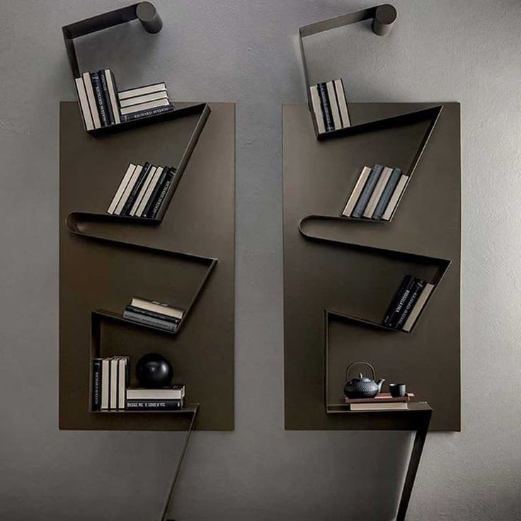 there are two bookshelves on the wall next to each other