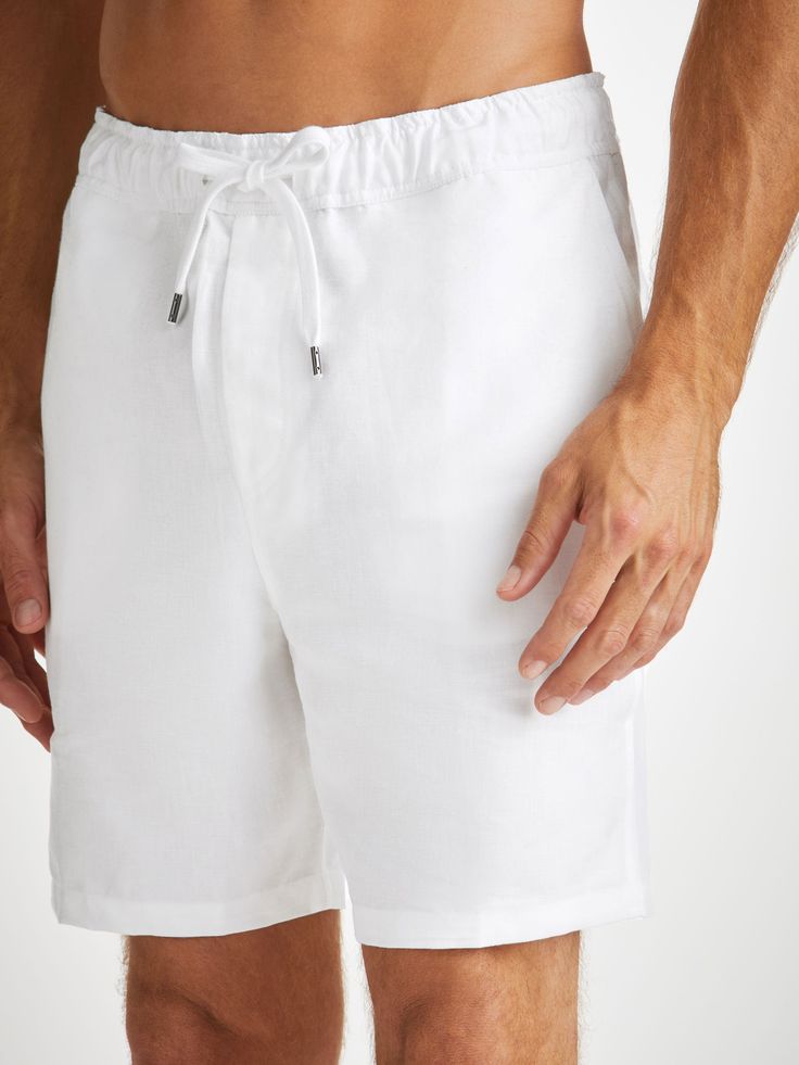 Our Sydney shorts in white are cut for a regular fit for the perfect, warm weather ready style. We have developed a mid-weight, beautifully soft and breathable pure linen that will keep you cool and comfortable in even the hottest of conditions. This made in Italy fabric is finished by being piece-dyed before construction for a bright and vibrant pure white. The Sydney short features a curved back yoke for a great fit and an elasticated waistband with drawcord for comfort. The front of the short Relaxed White Bottoms Short Length, Relaxed White Shorts For Spring, White Linen Bottoms For Vacation, White Cotton Bermuda Shorts For Summer, White Bermuda Bottoms For Beach, White Bermuda Shorts For Summer Vacation, White Linen Bermuda Shorts For Vacation, White Summer Bermuda Shorts For Beach, Relaxed Linen Bottoms For Beachwear