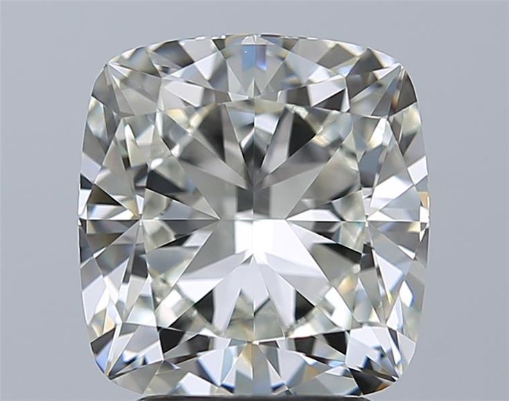 a cushion cut diamond on a gray background