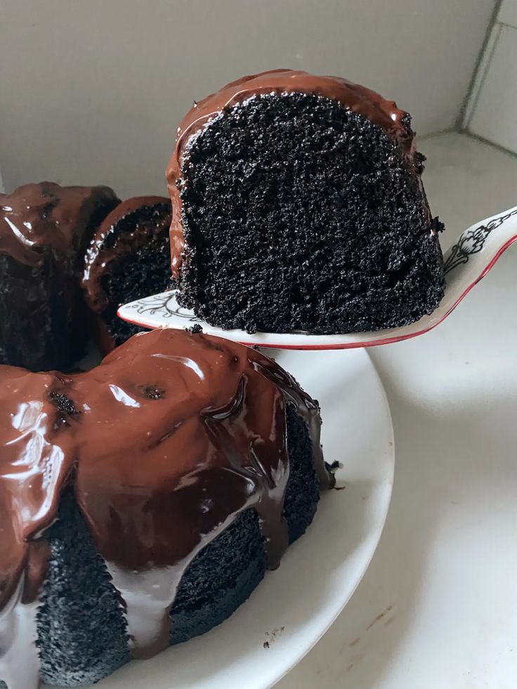 a piece of chocolate cake on a white plate