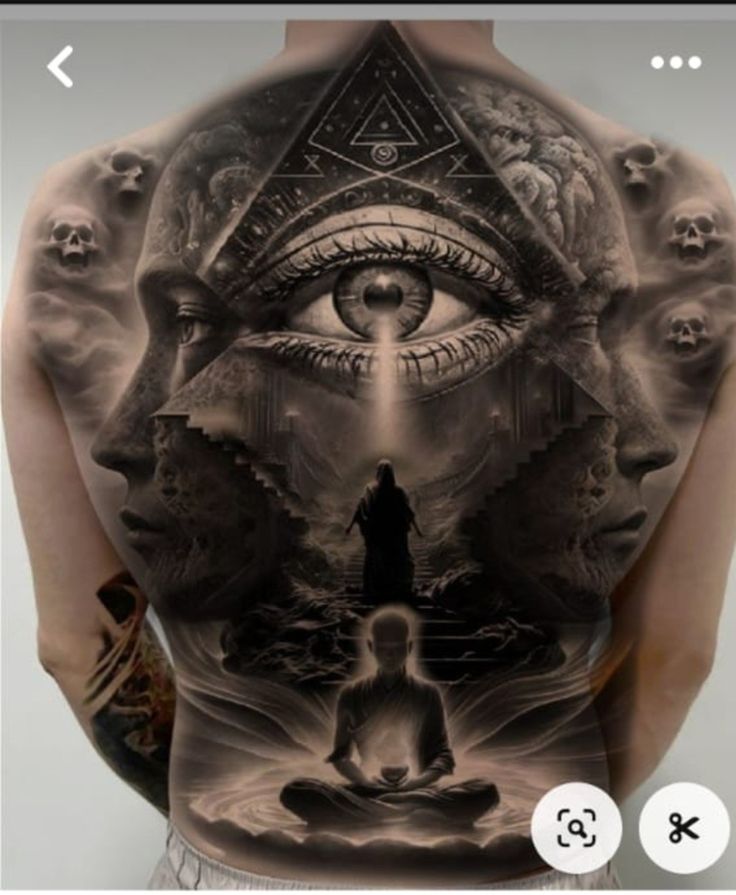 the back of a man's body with an all seeing eye tattoo on it