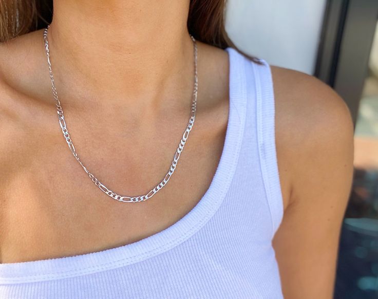 Details: Sterling Silver Figaro Chain Classic Sterling Silver Figaro Chain Necklace, White Gold Figaro Link Chain Necklace, Silver Figaro Chain Necklace With Oval Links, Silver Figaro Chain Link Necklace, Silver Figaro Link Chain Necklace, White Gold Figaro Chain Link Jewelry, White Gold Necklace With Figaro Chain Link, White Gold Oval Link Jewelry With Figaro Chain, Sterling Silver Figaro Chain Jewelry