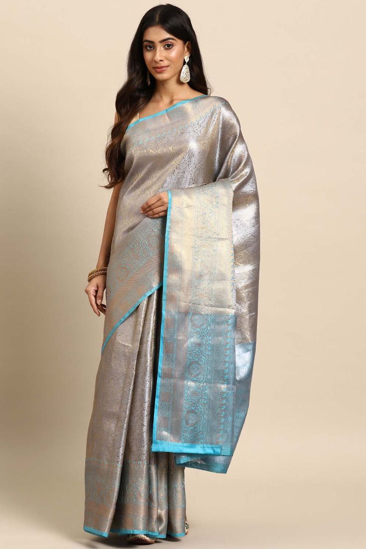 Beautiful saree is embellished with kota zari is from Silk Land on Karma Place, copper zari as well, it's lightweight saree along with easy to carry, must have in the wardrobe. Saree has a heavy zari thread for that it's giving a rich look while wearing. Have a contrast border and unstiched blouse piece. You can pair this saree with heels and minimal jewellery for party look.Product Features: Saree Color: Blue Saree Fabric: Tissue Blouse Fabric: Tissue Work: Woven Pattern: Floral Occasion: Festi Eid Celebration Pre-draped Saree With Zari Weaving, Festive Celebration Pre-draped Saree With Zari Weaving, Silver Saree Blouse Piece In Tissue Silk, Designer Silver Tissue Silk Saree, Silver Pre-draped Saree With Zari Work For Festive Occasion, Silver Tissue Silk Blouse With Zari Work, Silver Tissue Silk Dupatta With Zari Work, Silver Zari Work Tissue Silk Dupatta, Silver Art Silk Saree With Dupatta