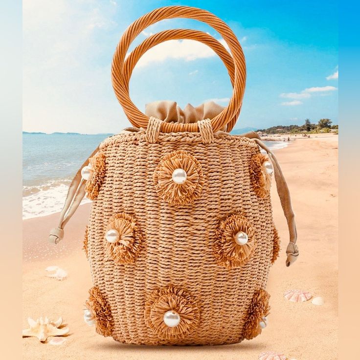 Straw Bucket Top Handle Handbag With Pearl In Flower Details * Khani Color * Straw Bag * Pearl Details * Mini Size * Bucket Shaped * 100% Polyester * Product Measurements (Please See Photos) White Bucket Bag With Detachable Handle For Beach, Beach White Bucket Bag With Detachable Handle, Beach Bucket Bag With Detachable Handle In White, Beige Vacation Bag With Pearl Handle, Beige Bag With Pearl Handle For Vacation, Vacation Beige Bag With Pearl Handle, Summer Pouch Shoulder Bag With Pearl Handle, Summer Shoulder Bag With Pearl Handle And Pouch Shape, Summer Pearl Handle Pouch Shoulder Bag