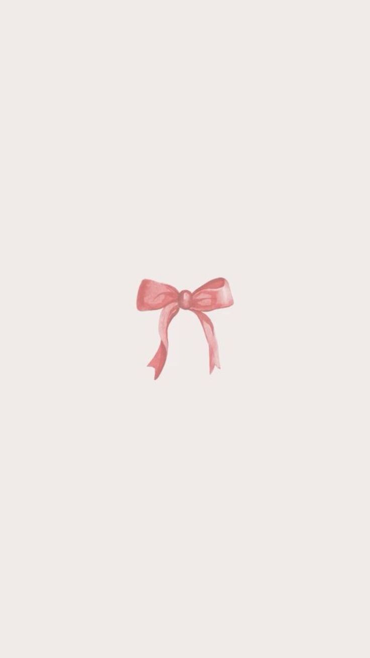 a pink bow on top of a white wall