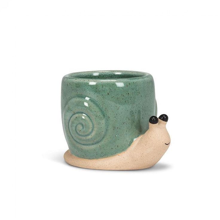 a ceramic cup with a snail on it