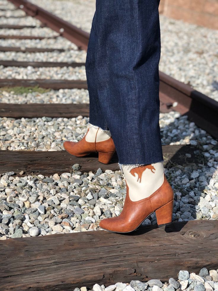 1950's Inspired Bucking Horse Adorned Western Boots. Proud To Be 100% Vegan Friendly. Upper Material: Faux Textured Leather Lining: Man Made + Fabric Step In Boot w/ Inner Tab For Easy Access. Heel Height: 3" Inches Approximate Shaft Height: (based on size 6 from top to back counter) 7 1/2" Inches / Mid Calf Height Fits True To Size, Please Size Up 1/2 If You Take A Wider Width. For Any Sizing Suggestions, Please Contact Customer Care. Imported Retro High-heeled Winter Boots, Retro High Heeled Winter Boots, Retro High Heel Winter Boots, Retro High Heeled Boots For Winter, Vintage Fitted Heeled Boots For Rodeo, Retro Spring Heeled Boots With Pointed Toe, Retro Style Fitted Heeled Boots With Pointed Toe, Retro Styled Pointed Toe Fitted Heeled Boots, Retro Styled Fitted Heeled Boots With Pointed Toe