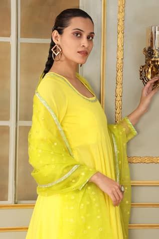 Yellow anarkali embellished with thread and gota work. Paired with a matching pant mirror work and dupatta. - Aza Fashions Transitional Chanderi Churidar, Eid Gota Work Churidar, Yellow Anarkali Palazzo Set, Bollywood Churidar With Cutdana, Yellow Anarkali Set With Sheer Dupatta, Anarkali Style Choli With Cutdana, Designer Wear Churidar For Transitional Seasons, Fitted Yellow Kurta With Sheer Dupatta, Traditional Drape Churidar With Mirror Work