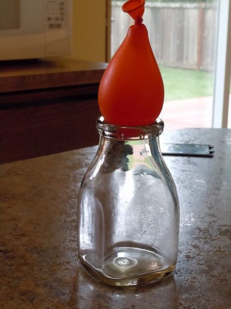 an orange bottle sitting on top of a counter