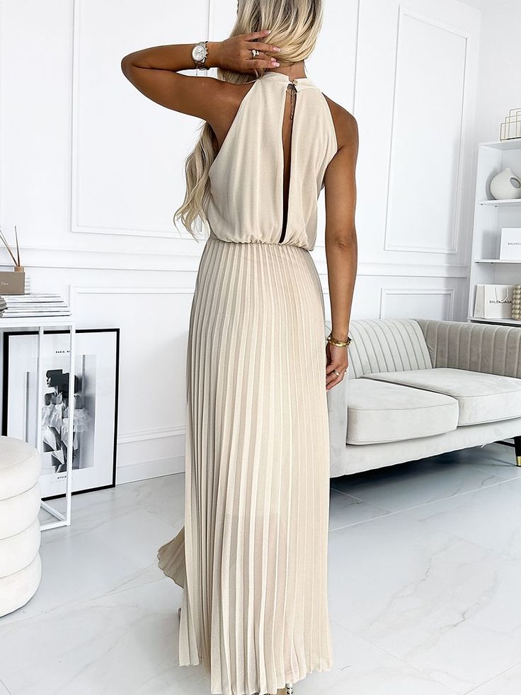 Pleated chiffon midi dress with a teardrop-shaped cutout on the neckline, and a deep neckline on the back. The dress comes in beige color. Numoco brand. European production. Spandex 5 % Polyester 95 % Size Lenght Hips Chest Waist one-size-fits-all 139 cm 76-116 cm 80-100 cm 66-78 cm Lace Neckline Dress, Sporty Dress, Chiffon Midi Dress, Pleated Chiffon, Bridesmaid Dresses Prom, Lace Neckline, Deep Neckline, Pleated Midi Dress, Confident Woman