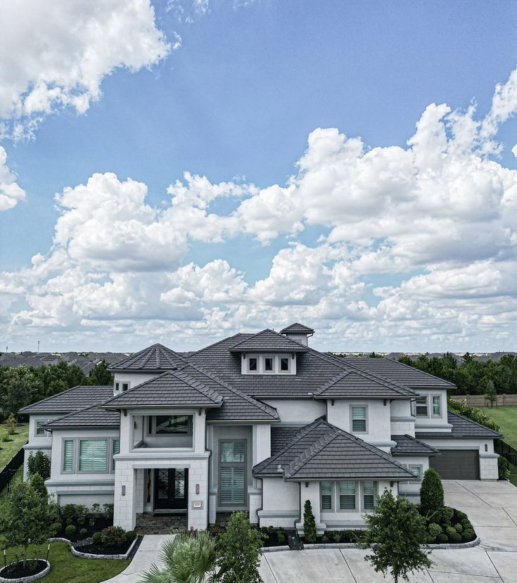 an aerial view of a large white house