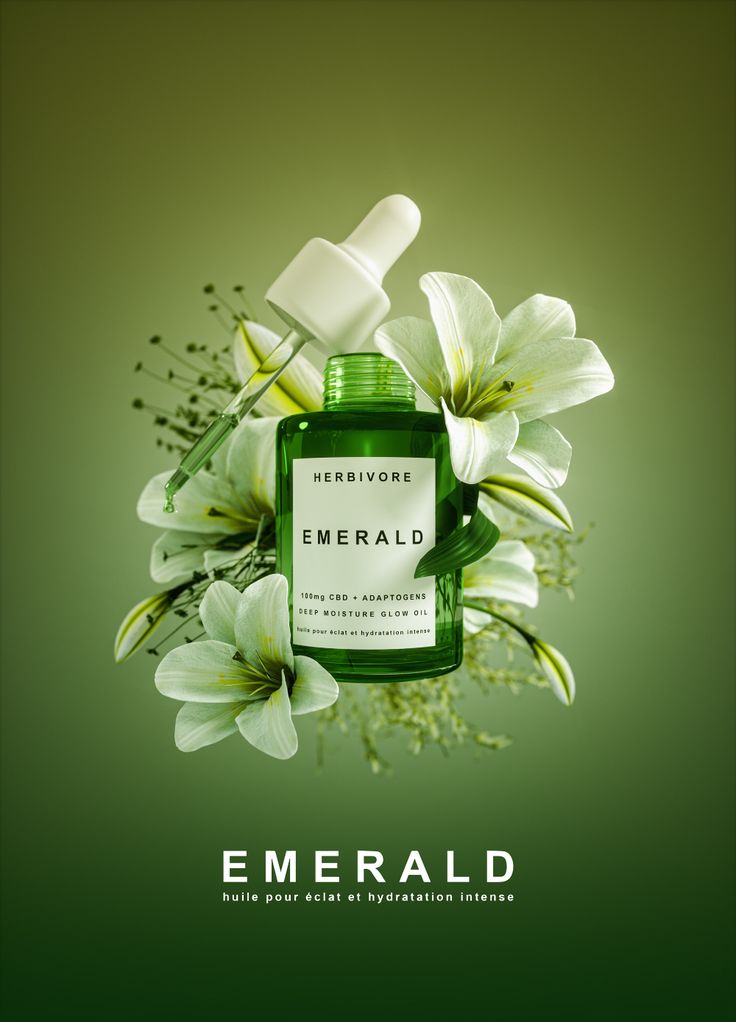 an advertisement featuring flowers and a bottle of emerald