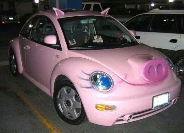 a pink car with pig ears painted on it