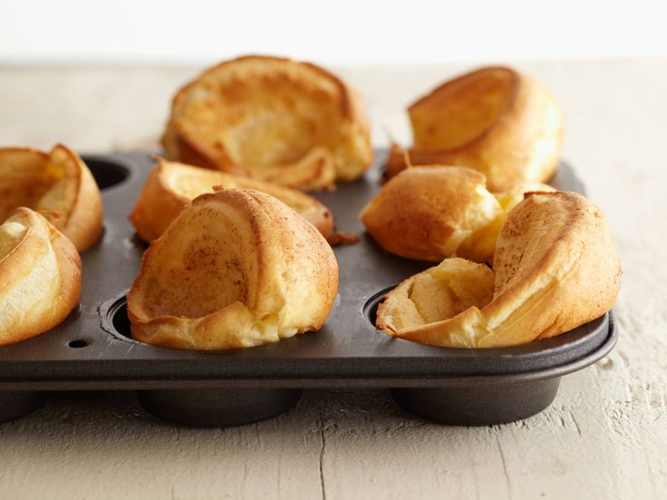 small pastries in a muffin tin on a table