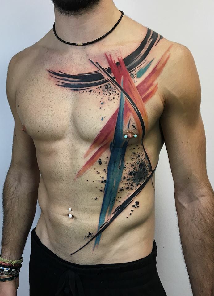 a man's chest with an abstract tattoo design on the side and back part