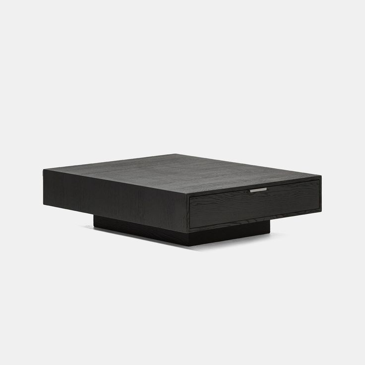 a black box sitting on top of a white surface