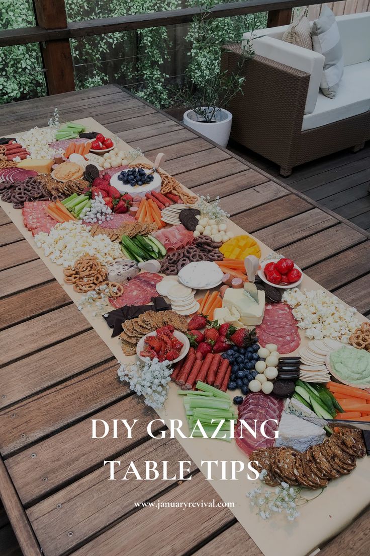 Image of colour, tasty grazing table with an assortment of sweet and savoury food and snacks. The text overlay says 'DIY grazing board tips'. Grazing Table Greenery, Buffet Platters Ideas, 40th Birthday Platter Ideas, Diy Charcuterie Grazing Table, Grazing Table For 15, Grazing Table On Brown Paper, Chip And Dip Grazing Table, Grazing Table Small Party, Simple Grazing Table Ideas Diy