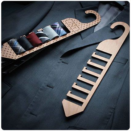 a wooden tie hanger with ties on it