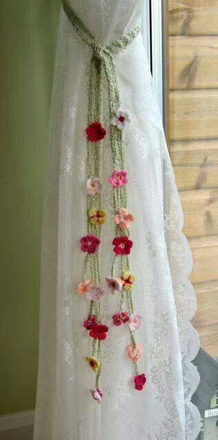 a white dress with flowers hanging from it