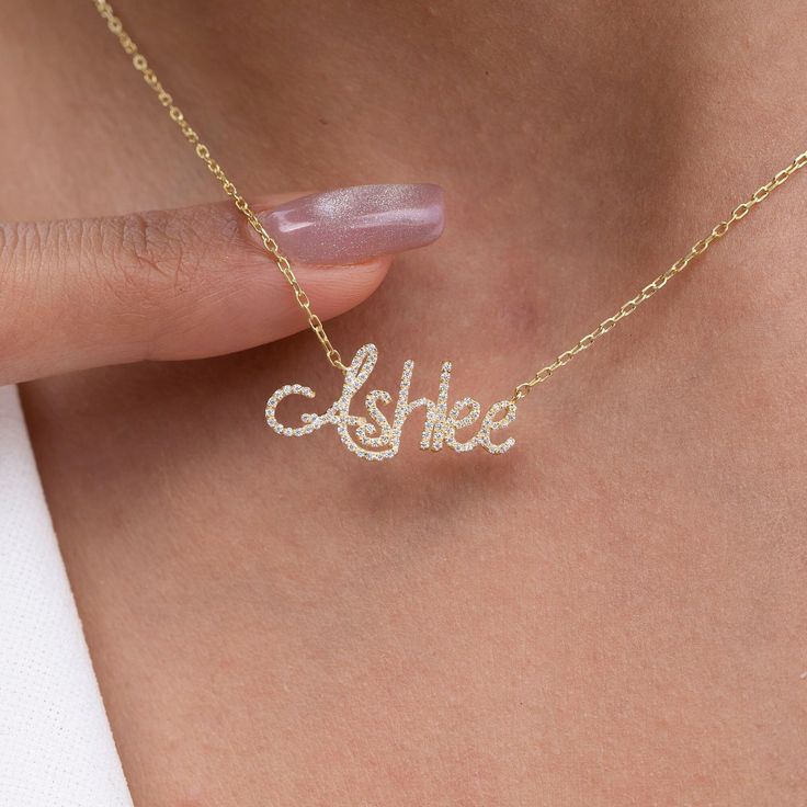 "This 14k personalized diamond name necklace is the perfect gift for the bridal party, someone special, or yourself.  How to order 1- Pick the fonts you like and send us a message 2- We will send you a picture of your name with the fonts you chose 3- If you like it any of them, place your order. 4- We send a final 3d mock up for approval. 5- Once approved we go ahead and finish your necklace. M A T E R I A L & L E N G T H Available in 14k Yellow Gold, 14k Rose Gold, 14k White Gold, Sterling Silver Stone: Natural Diamonds Thickness: 1.3mm / 0.05\" Initials Lowercase: 4-6 mm (Depending on the font) Capital: 9-12 mm (Depending on the font) Diamond weight: 0.15 ct. - 0.70 ct. depending on the name Chain Length:  14+2, 16+2 options or any length up to 20 inches without extension. (Please leave Gift Diamond Accents Initial Pendant Name Necklace, Personalized Yellow Gold Diamond Necklace Gift, Personalized Yellow Gold Diamond Necklace For Gift, Customizable Elegant Name Necklace For Anniversary, Elegant Personalized Diamond Necklace Gift, Elegant Customized Name Necklace For Anniversary Gift, Valentine's Day Elegant Custom Name Necklace, Diamond Initials Name Necklace As Gift, Diamond Initials Name Necklace For Gift