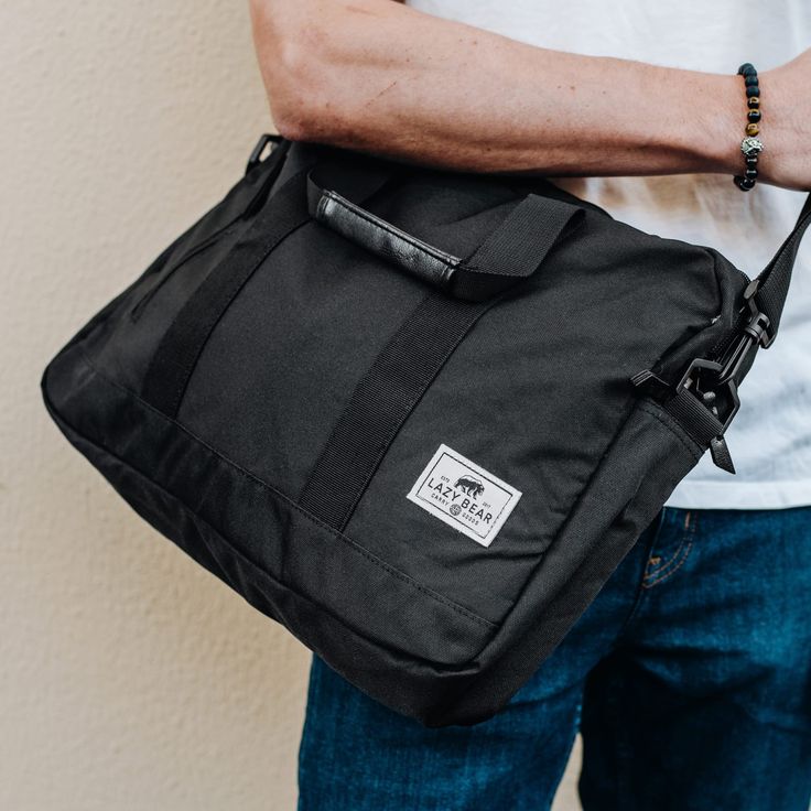 *  Slim, minimalist design  
 *  Removable shoulder strap  
 *  Padded compartment for laptop and tablet  
 *  Zippered front pocket Black Laptop Bag, Lewis Black, Lazy Bear, Black Laptop, Welcome To The Family, Leather Laptop Bag, Jewelry For Men, Leather Laptop, Black Faux Leather