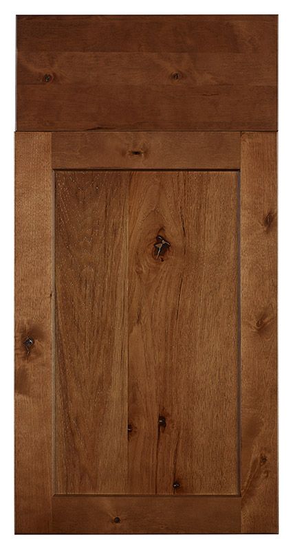 a close up view of a wooden cabinet door with wood grains on the bottom