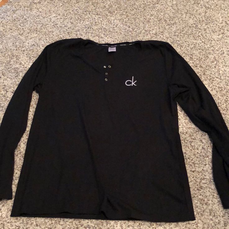 Black Calvin Klein Pajama Shirt. Brand New Without Tags. Never Worn Black Long Sleeve Cotton Sleepwear, Black Cotton Long Sleeve Sleepwear, Black Long Sleeve Sleepwear For Relaxation, Black Cotton Sleepwear For Spring, Black Long Sleeve Sleep Top, Black Long Sleeve Sleepwear For Lounging, Black Cotton Sleepwear For Relaxation, Casual Black Sleepwear For Spring, Black Cotton Lounging Top