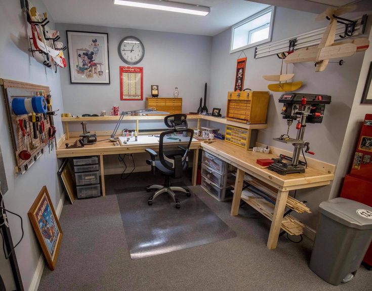 a workbench with lots of tools on the desk and shelves in front of it