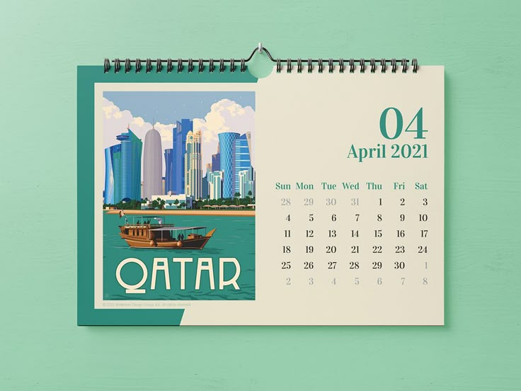 a calendar with a boat on the water in front of a cityscape that says qatar