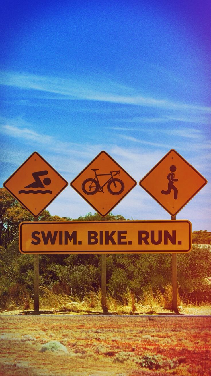 there are three road signs that say swim, bike, run