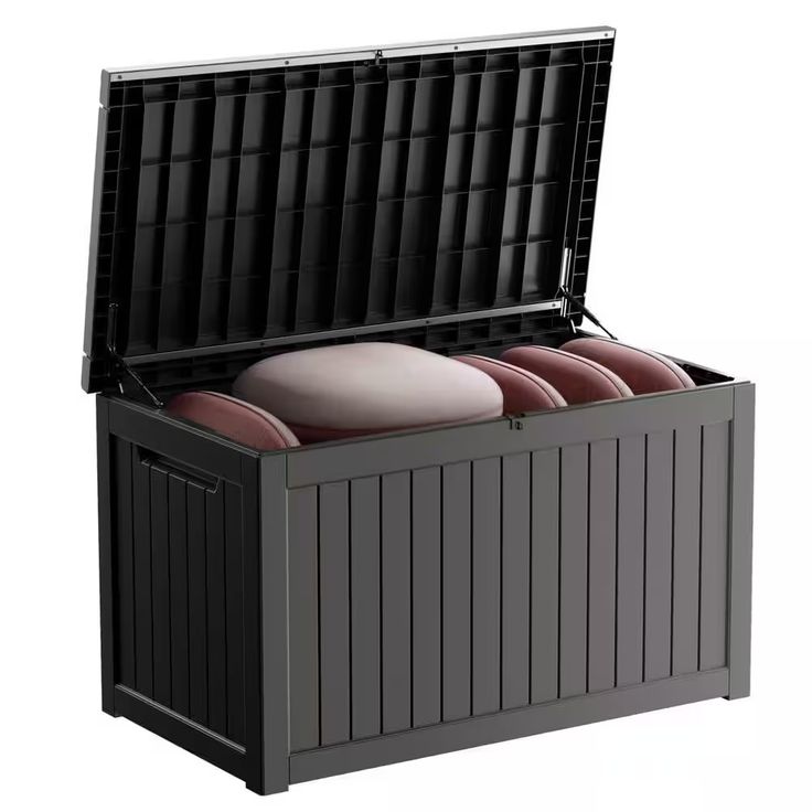 an outdoor storage box with four red cushions in the lid and two black plastic bins