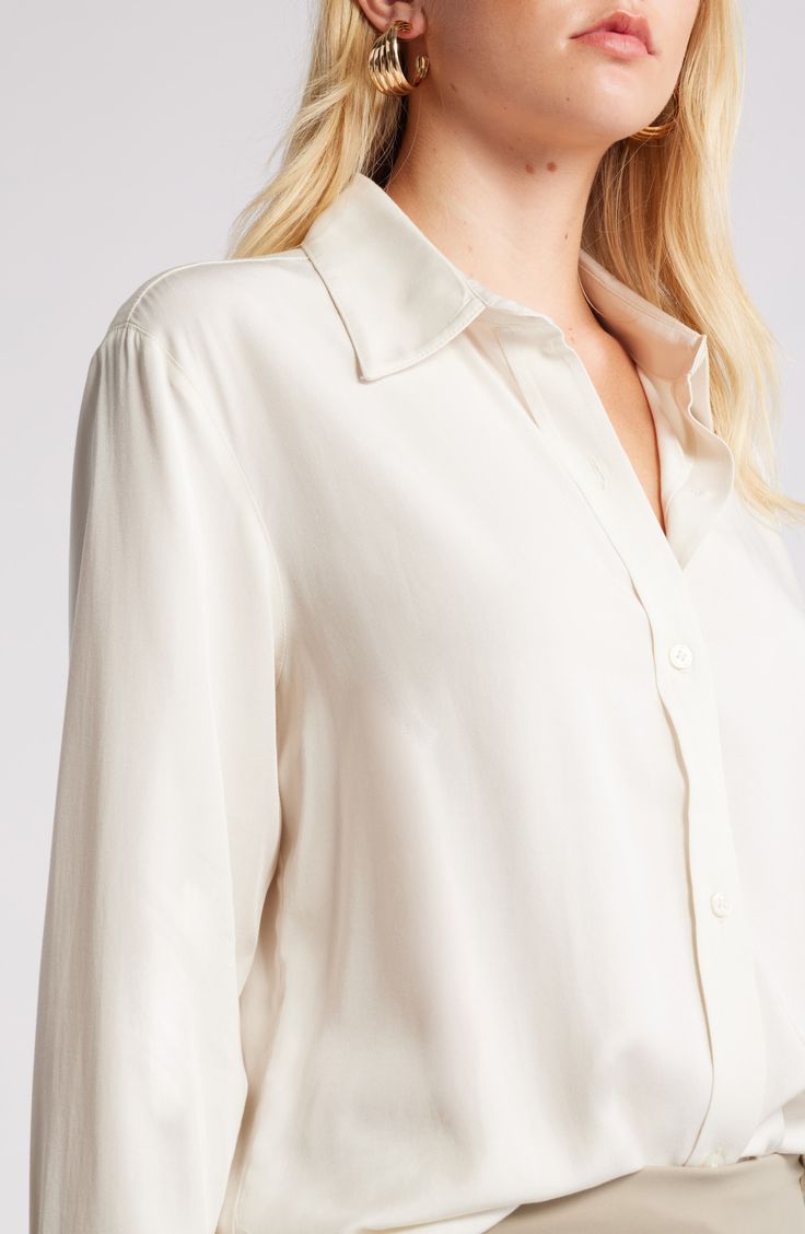 Cut in relaxed fit, this lightweight button-up shirt is what to wear on casual days whether you're in or out of the office. 29 1/2" length (size Medium) Front button closure Point collar Long sleeves with button cuffs 70% rayon, 30% lyocell Machine wash, line dry Imported Everyday Dress Shirt With Relaxed Fit And Long Sleeves, Relaxed Fit Long Sleeve Dress Shirt For Everyday, Everyday Relaxed Fit Long Sleeve Dress Shirt, Classic White Blouse With Hidden Button Closure, Classic White Blouse With Hidden Buttons, White Long Sleeve Blouse With Hidden Button Closure, Classic Tops With Rolled Sleeves For Fall, Classic Blouse With Rolled Sleeves For Business Casual, White Blouse With Shirttail Hem And Placket